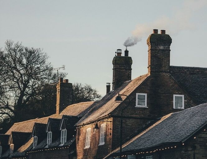 What is the difference between a chimney and a flue?