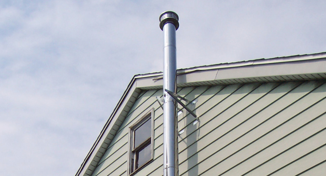 Should You Install Your Chimney Pipe on the Outside of the House?