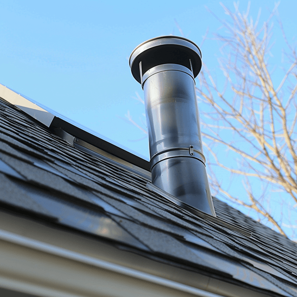 a flue pipe protruding from a roof