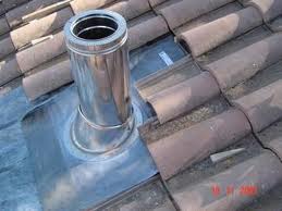 Chimney pipe throug a tiled roof